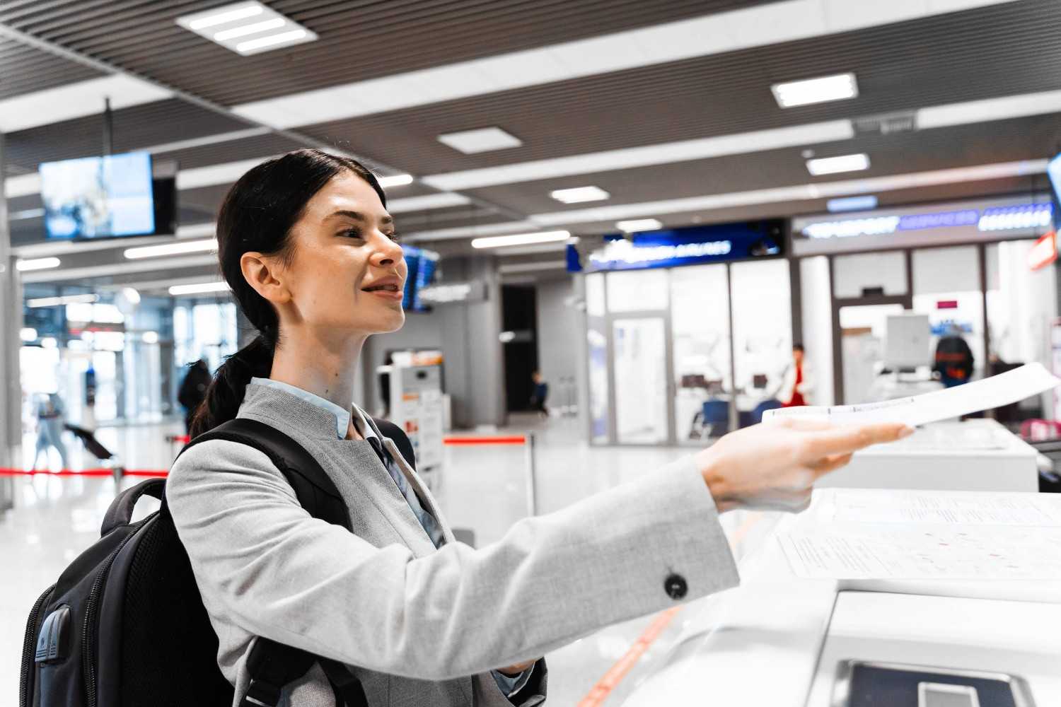 Woman Giving Documents At Immigration